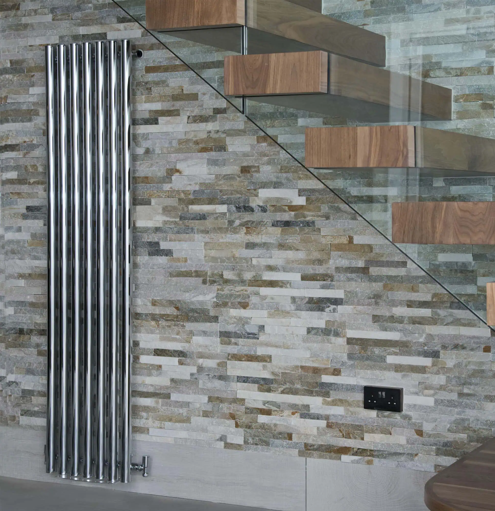 Mayfair-Vertical-Chrome-Lifestyle-1.jpg Polished chrome towel radiator in modern interior home decor.