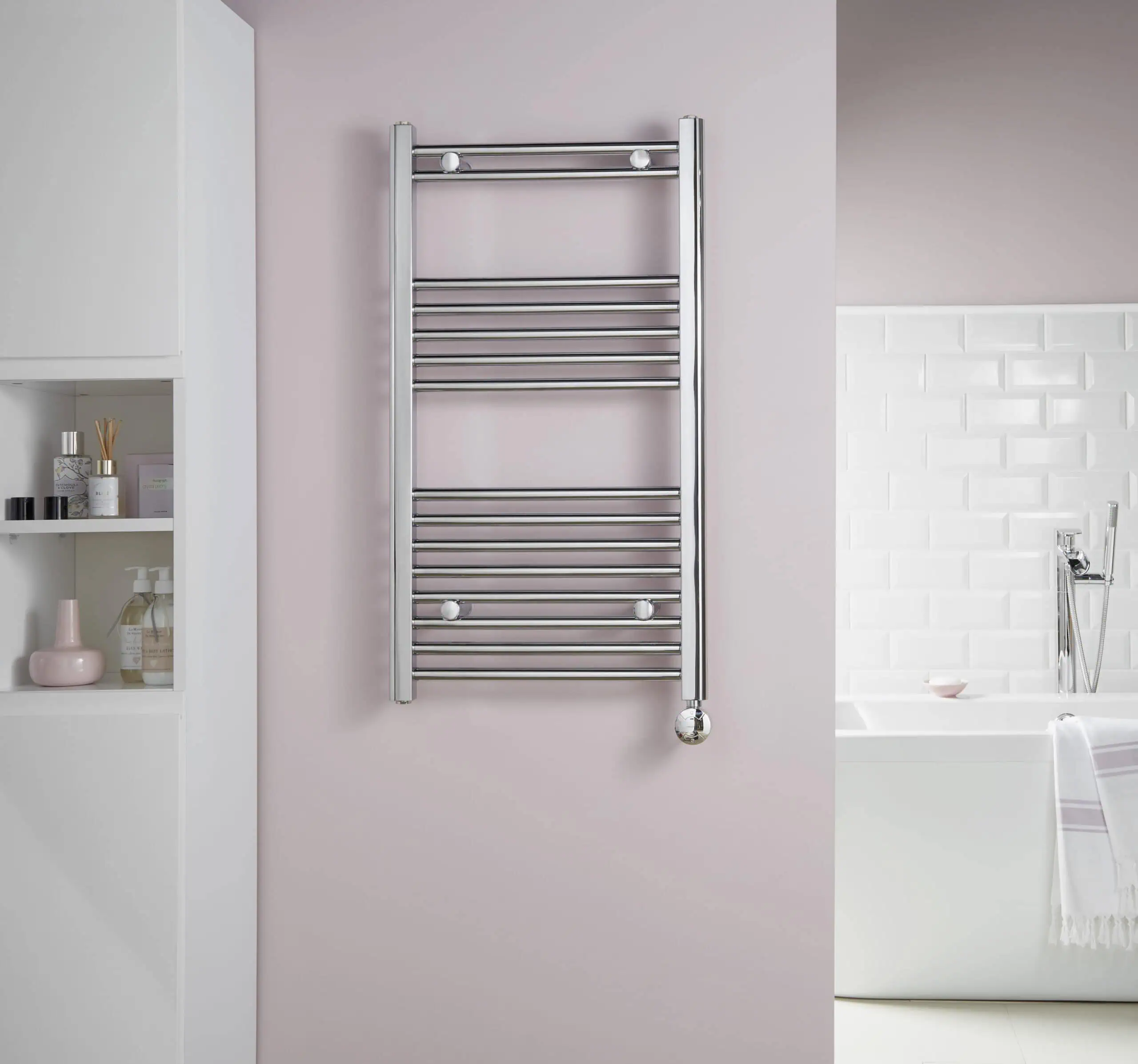 McCarthy-Lifestyle-scaled-2.jpg Polished chrome towel radiator heater in modern bathroom setting.
