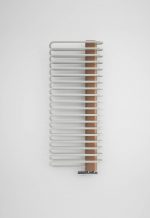 Modern towel radiator with white and copper design, ideal for bathroom heating solutions.