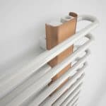 Elegant white and bronze handrail with integrated modern grab bar, ideal for healthcare and accessibility facilities.