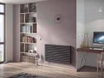 Modern radiator installed in a stylish home office with a bookshelf and contemporary decor.