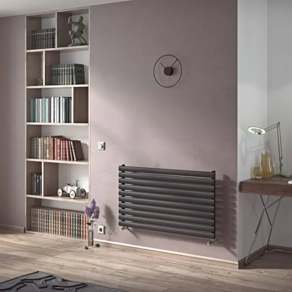 Modern living room with stylish black radiator, wooden bookshelf, and workspace setup.
