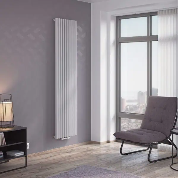 Modern vertical radiator in a stylish living room with large windows and contemporary decor.