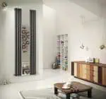Modern vertical radiator with black pipes and sleek design for stylish home heating.