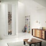 Modern minimalist living room with stylish radiator, white shelving, and wooden furniture, ideal for contemporary home decor.