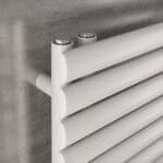 Modern white radiator with horizontal panels for efficient heating.