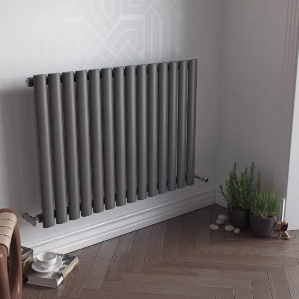 Modern metallic radiator for heating and decor in a contemporary home setup.