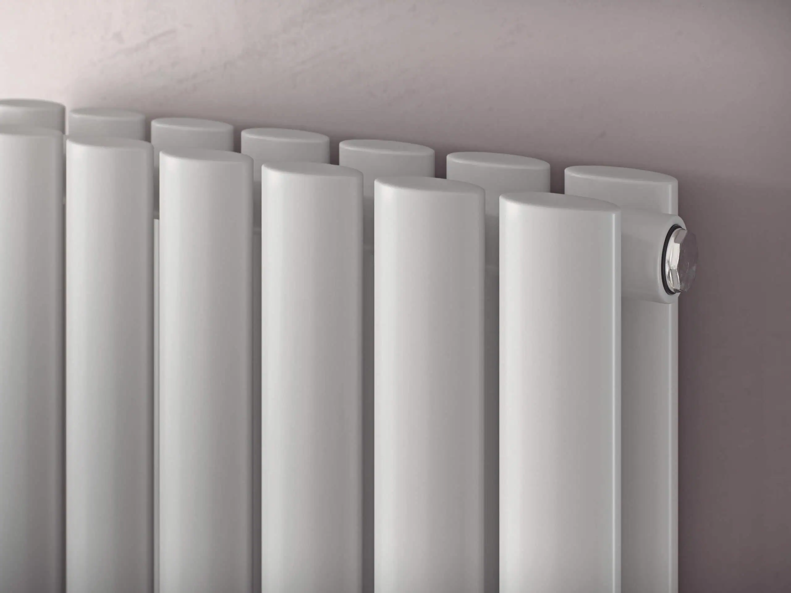 Nova-Vertical-Double-White-Detail-scaled-2.jpg Modern white radiator for central heating systems, sleek and efficient design.