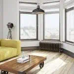 Bright modern apartment with large windows and minimalist decor for rent.