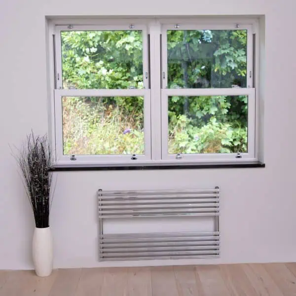 Double-glazed UPVC windows with forest view, energy-efficient home insulation, modern window installation.