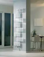 Modern white radiator heater in minimalist home interior.