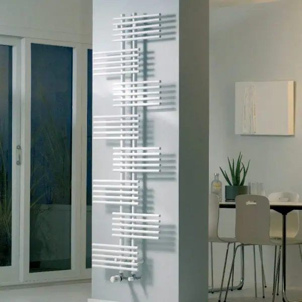 Modern white radiator heater in minimalist home interior.