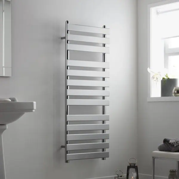 Modern white electric towel radiator in a contemporary bathroom setting.