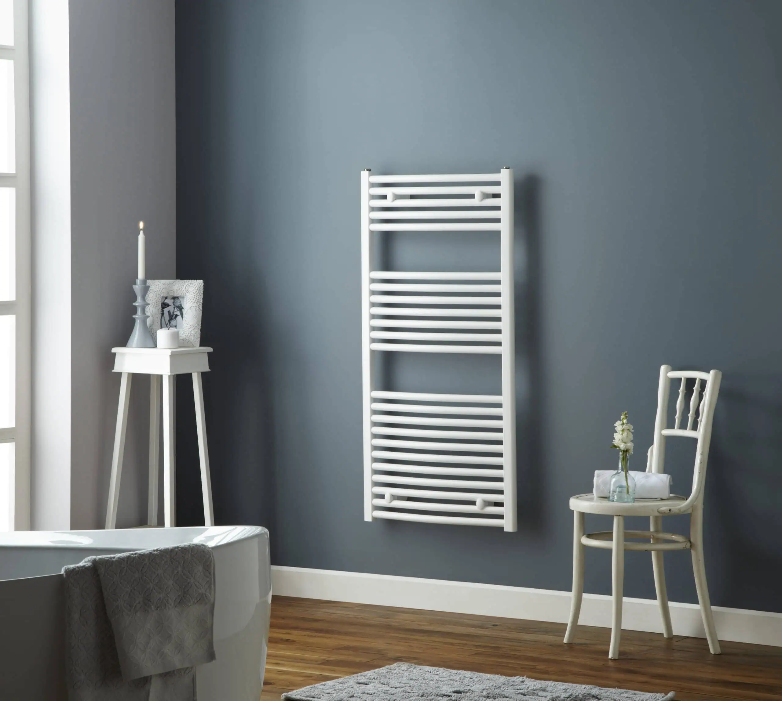 Pisa-White-Lifestyle-2-scaled-2.jpg Modern heated towel rail in a stylish bathroom, perfect for luxury home comfort.