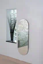 Modern wall mirror with sleek design and decorative interior style.