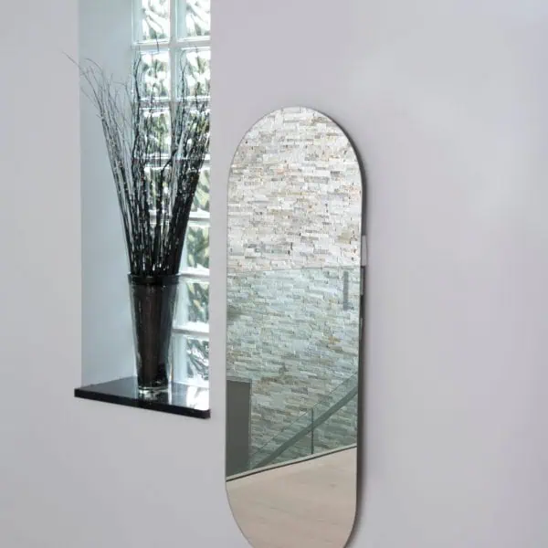 Modern wall mirror with sleek design and decorative interior style.