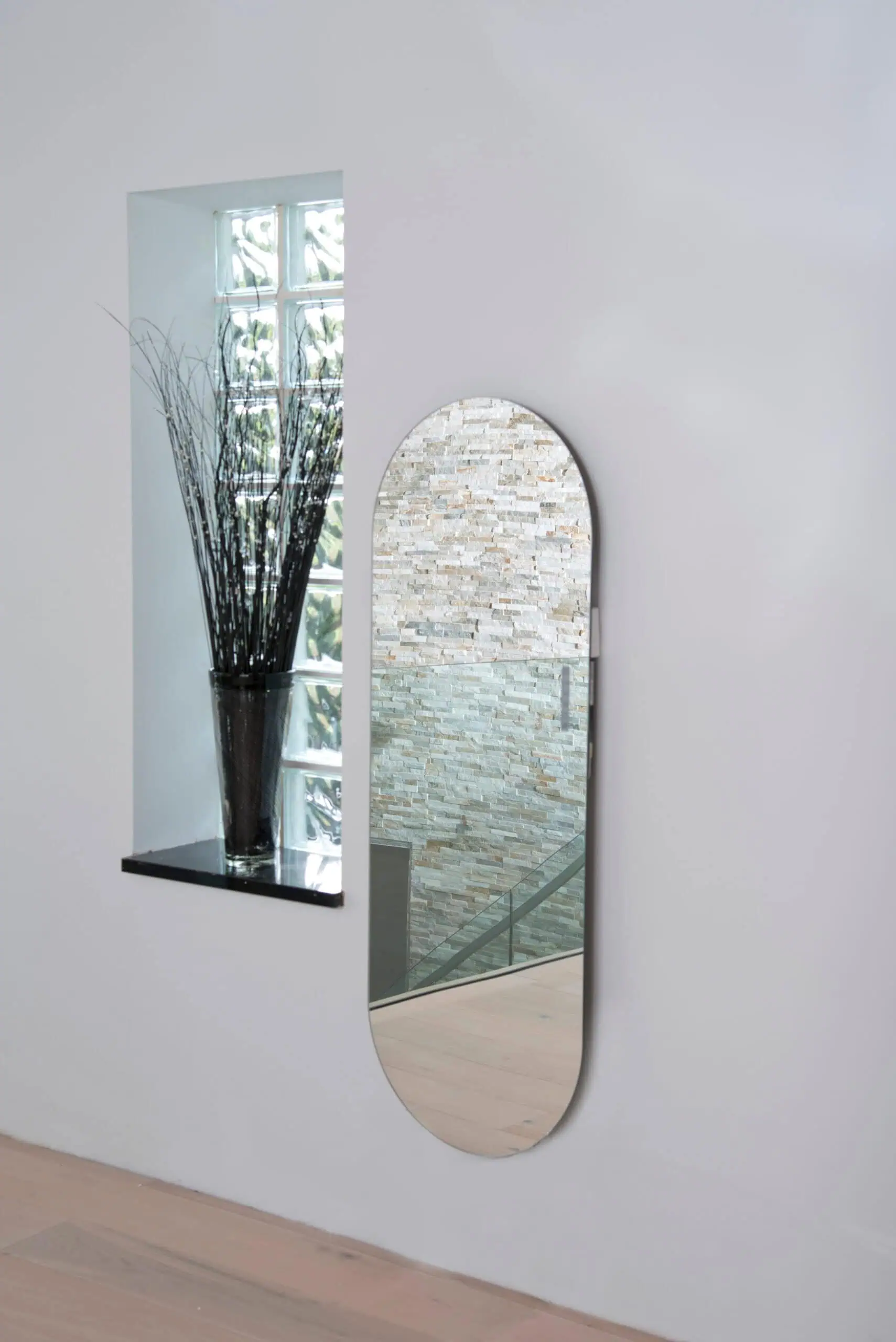 Soap-Mirror-Lifestyle-rgb-scaled-2.jpg Modern wall mirror with sleek design and decorative interior style.