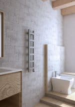 Modern minimalist bathroom with natural wood accents and textured concrete wall.