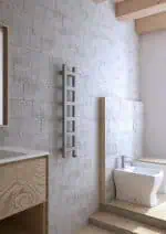 Modern minimalist bathroom with natural wood accents and textured concrete wall.