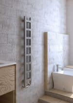 1. Modern vertical radiator in contemporary bathroom with light stone wall.