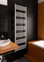 Modern towel radiator heater in contemporary bathroom decor.