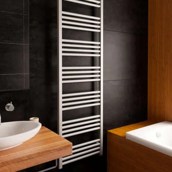 Modern towel radiator heater in contemporary bathroom decor.