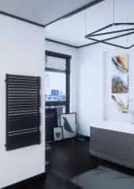 Modern black towel radiator heater for stylish bathroom decor.