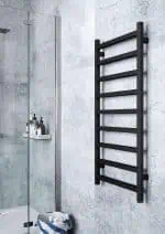 Wall-mounted black towel radiator for bathroom heating and drying.