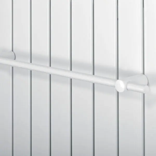 White radiator with safety bar for home heating and heat control.