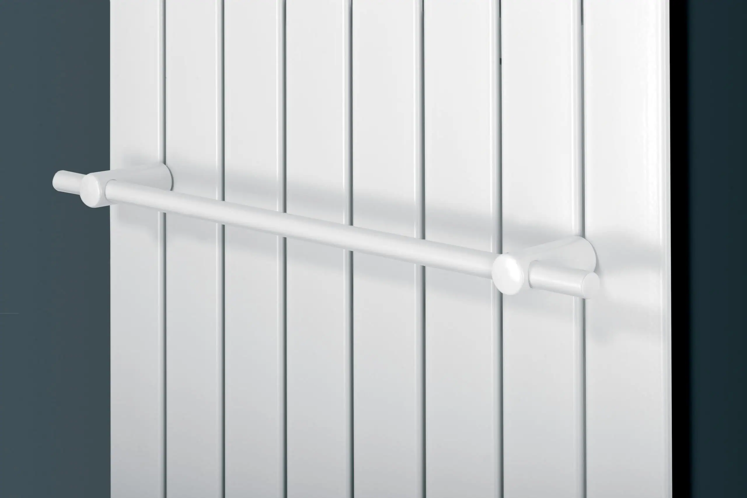 Towel-Rail-White-scaled-2.jpg White radiator with safety bar for home heating and heat control.