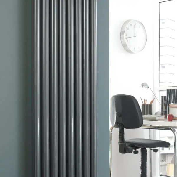 Tall modern vertical radiator for heating e space in contemporary interiors.