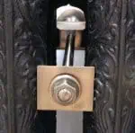 - High-security brass door lock with key cylinder and sleek modern design.