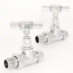 Shiny metal tap valves for plumbing or water control, close-up image.