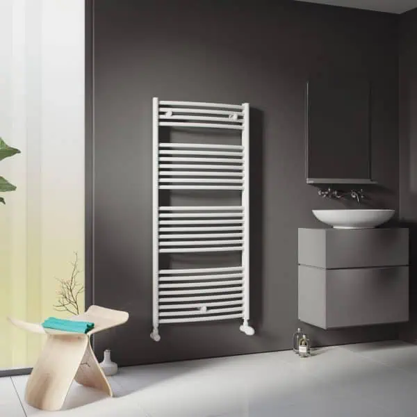 Modern bathroom with towel radiator, floating vanity, vessel sink, and stylish decor.