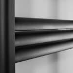 Polished black metal louvered vent for residential or commercial HVAC systems.
