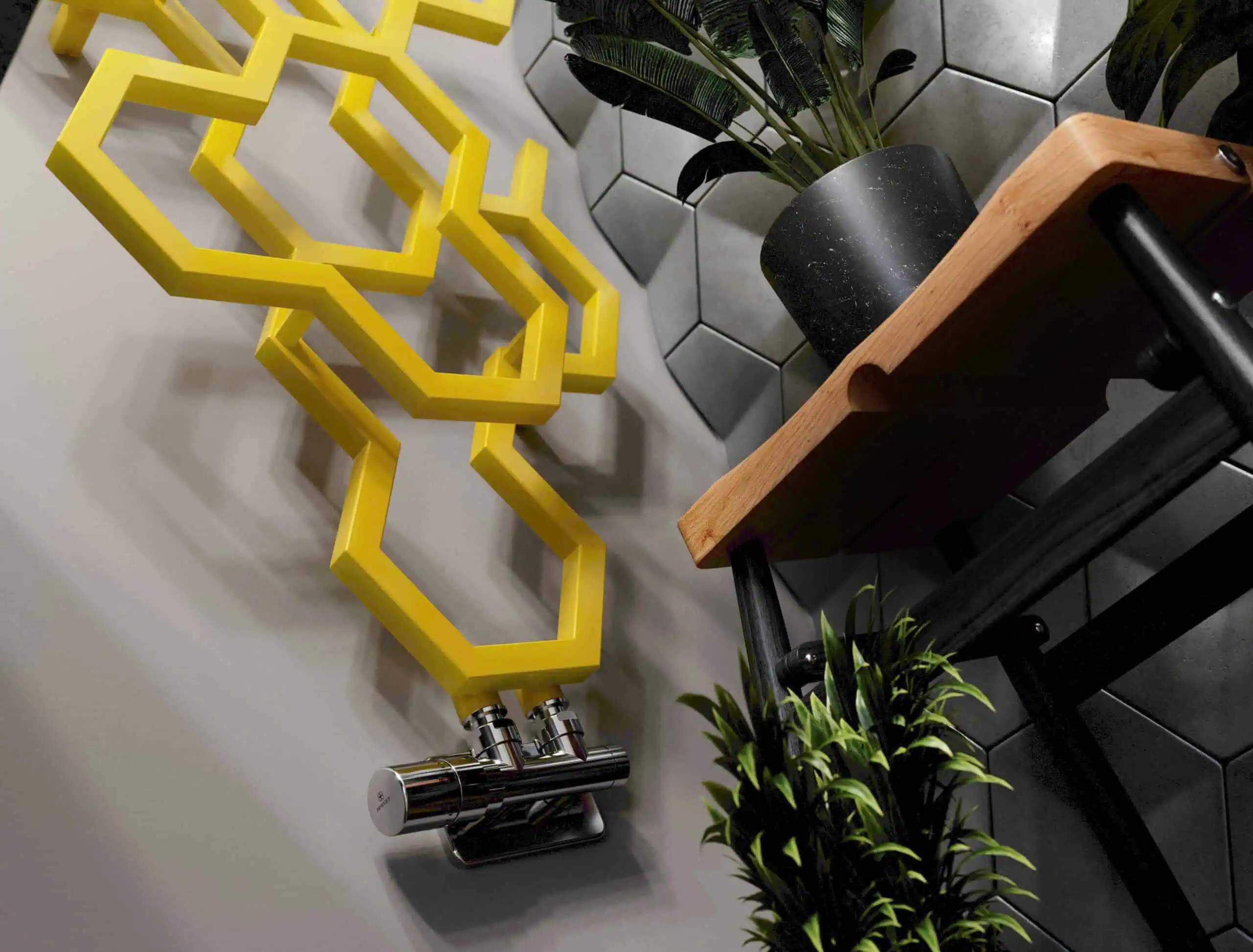 Bright yellow geometric radiator with chrome valves in modern interior setting.
