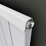 Radiator with chrome thermostat control for efficient home heating and temperature regulation.