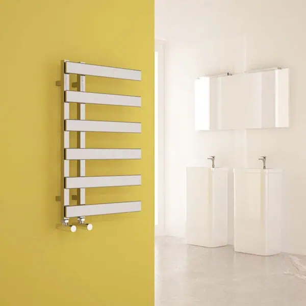 Modern white towel radiator on a yellow wall in a contemporary bathroom setting.