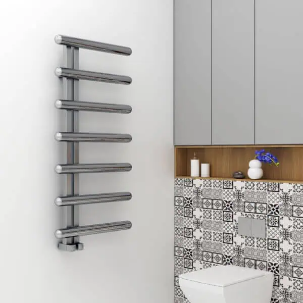 Sleek modern chrome towel radiator in a stylish bathroom setting.