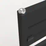 Screw in a black electronic device or battery pack with a silver screw head close-up.