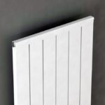 Modern white panel radiator for home heating systems.
