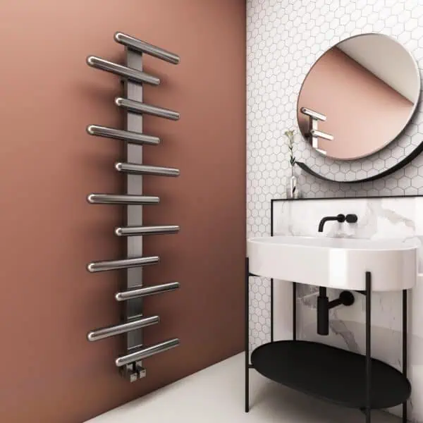 Sleek modern bathroom with contemporary heated towel rail and minimalist sink area.
