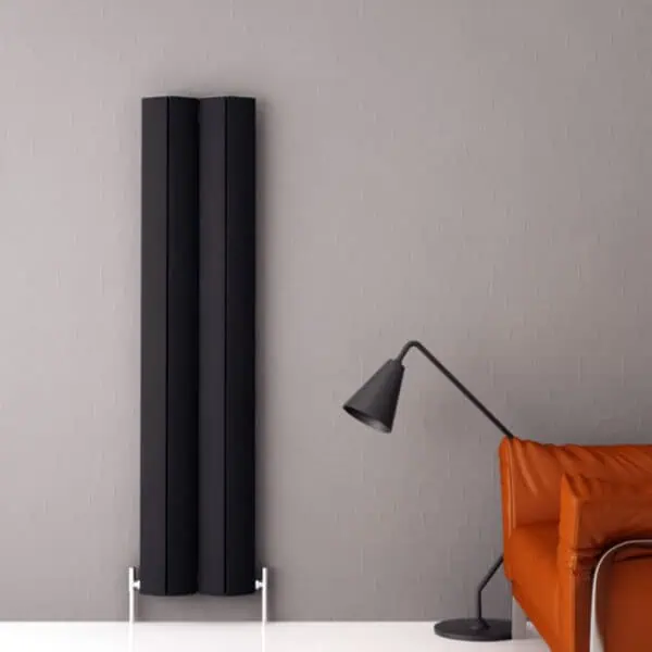 Modern black radiator heating panel in a stylish interior setting.