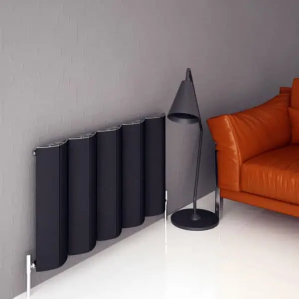Black modern radiator with sleek design and wall-mounted installation for contemporary home heating solutions.