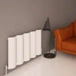 White modern radiator with sleek design in living room setup.