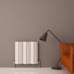 Modern radiator and floor lamp in stylish living room, cozy home decor setup.