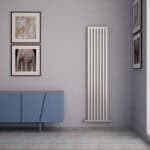 Stylish modern vertical radiator in a contemporary living space | Poshrads.