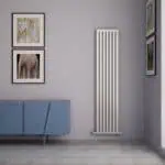 Stylish modern vertical radiator in a contemporary living space | Poshrads.