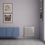 Modern interior wall decor with framed animal and art prints, blue cabinet, and white radiator.