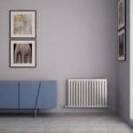 Elegant interior with framed art and a modern radiator for contemporary home decor.